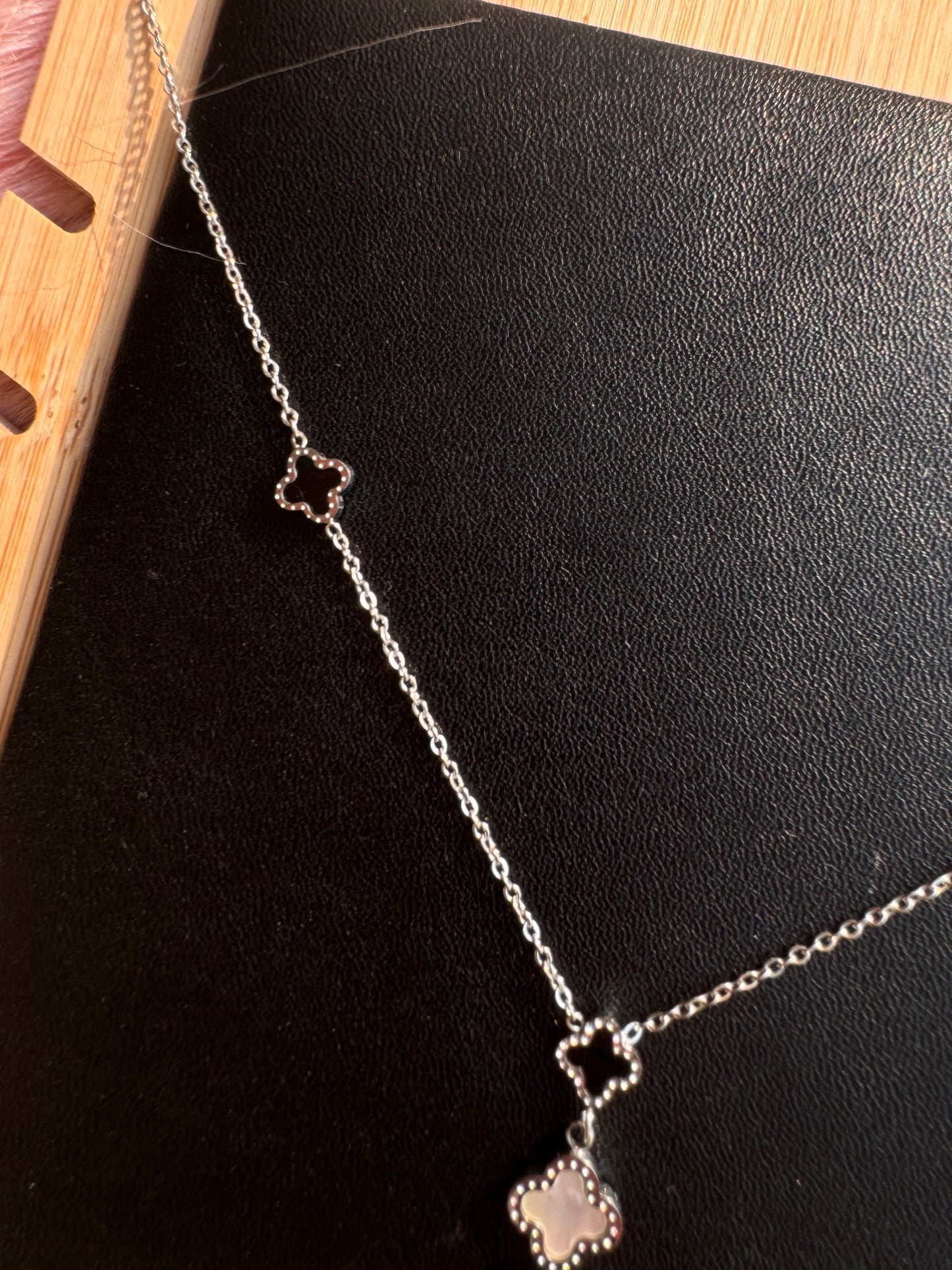 Silver Triple Clover Drop Necklace – Black & White Accents