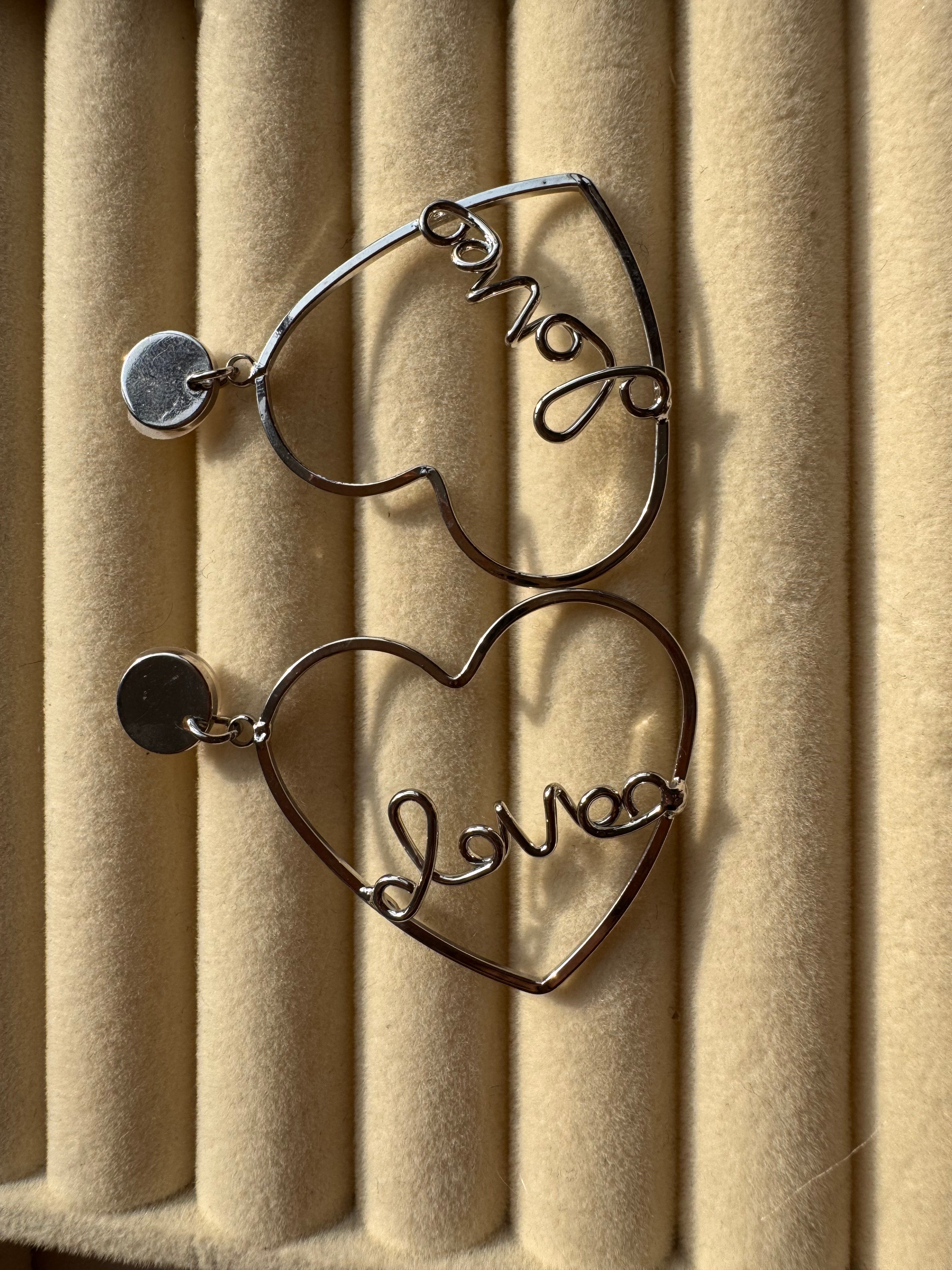 The Silver "Love" Heart Statement Drop Earrings