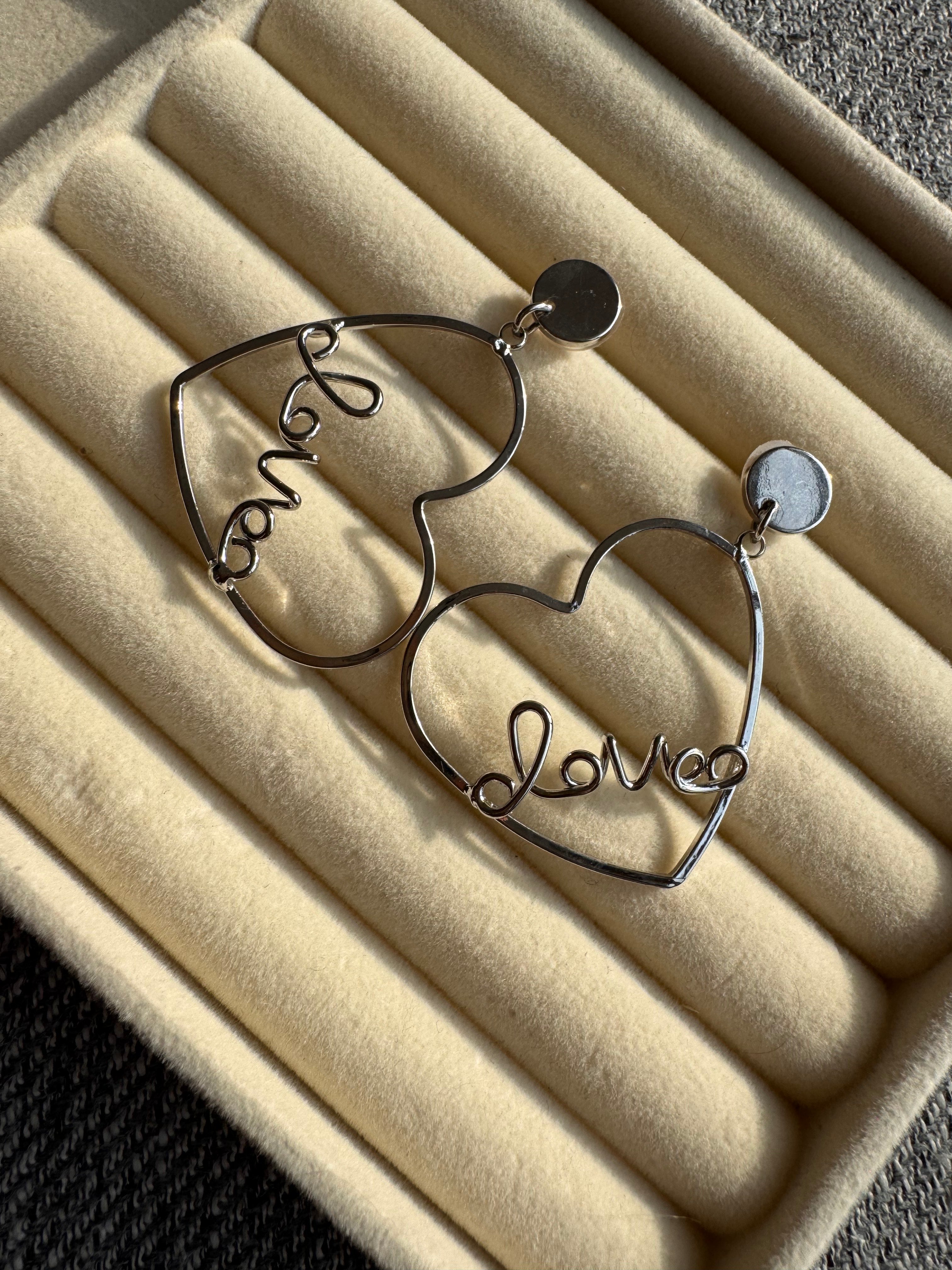 The Silver "Love" Heart Statement Drop Earrings